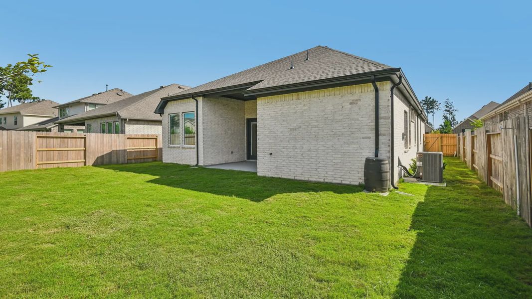 Exterior details and patio area of a home in Artavia, Conroe (Image 4).