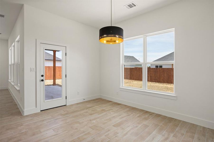 Spare room featuring light wood-type flooring