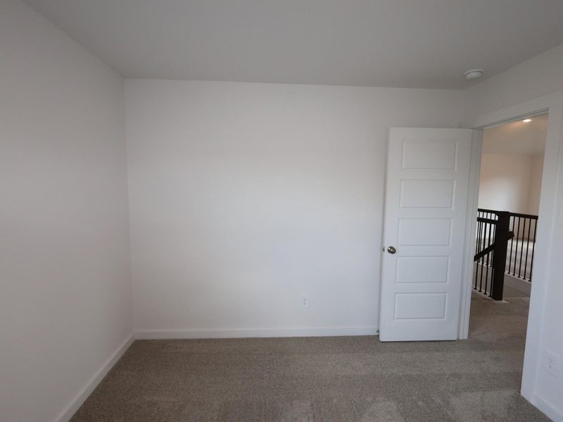 Spacious, unfurnished interior of a new home in Pinewood at Grand Texas, New Caney (Image 21).