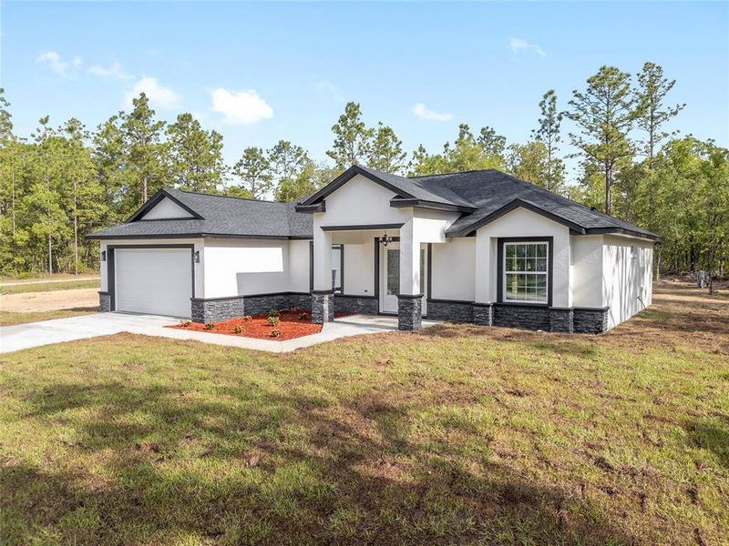 Front exterior of a new home in , Dunnellon, FL, highlighting curb appeal (Image 30).