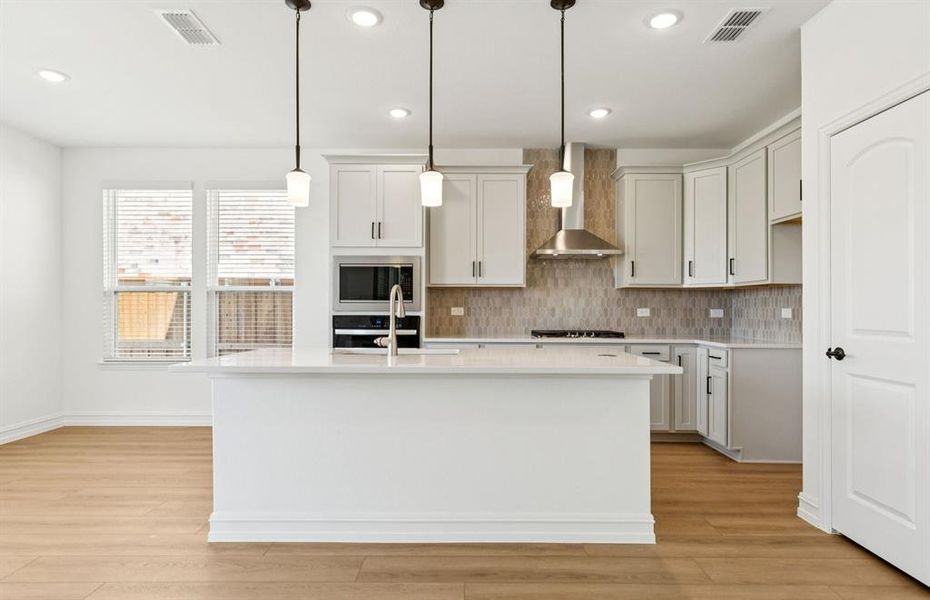 Spacious kitchen with eat-in bartop island Spacious kitchen with eat-in bartop island