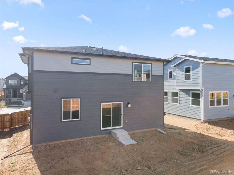 Exterior details and patio area of a home in The Cottages Collection at Ridgeline Vista, Brighton (Image 3).