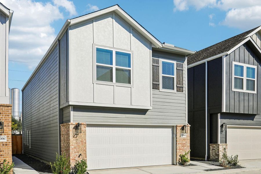 Front exterior of a new home in Spring Brook Village - City Series, Houston, TX, highlighting curb appeal (Image 20).