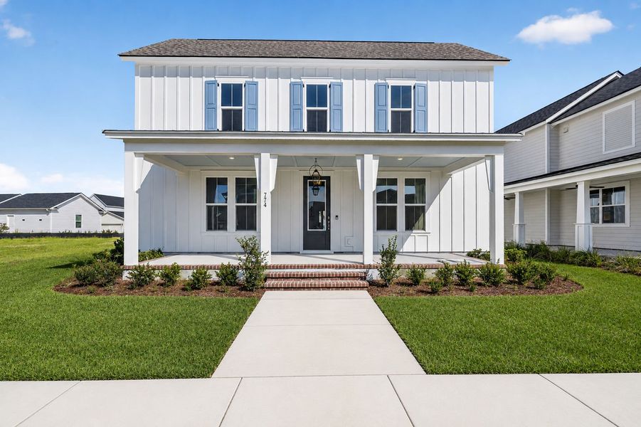 Front exterior of a new home in Nexton, Summerville, SC, highlighting curb appeal (Image 2). Front exterior of a new home in Nexton, Summerville, SC, highlighting curb appeal (Image 2).