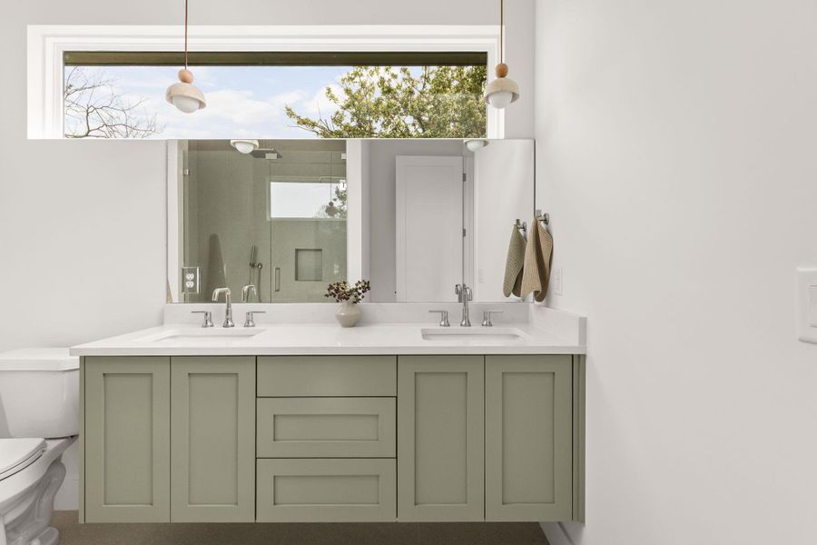 Bathroom with double vanity and plenty of natural light Bathroom with double vanity and plenty of natural light