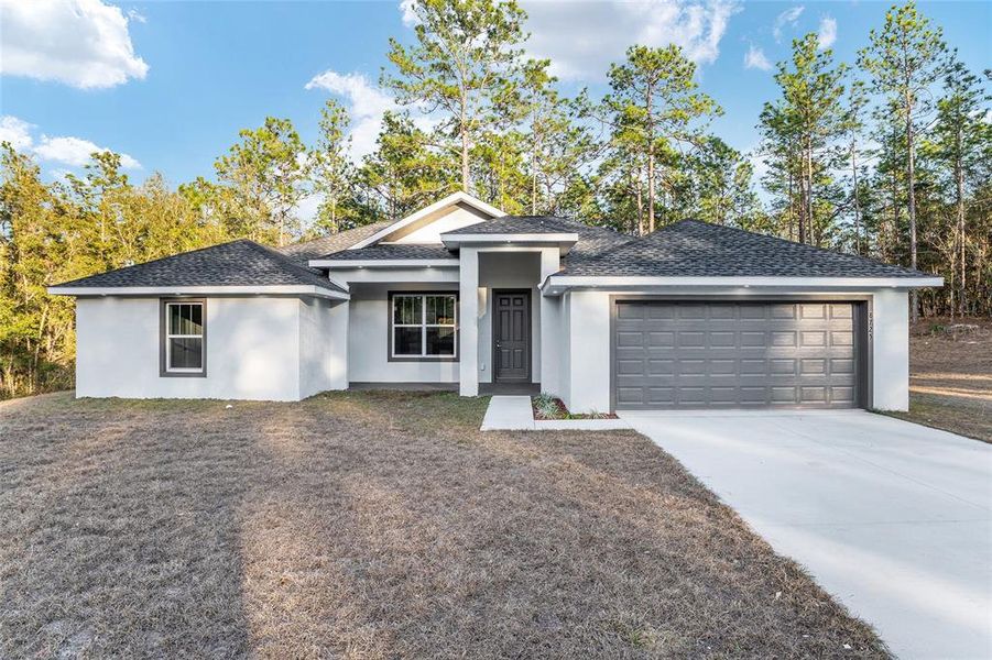 Front exterior of a new home in , Dunnellon, FL, highlighting curb appeal (Image 30).