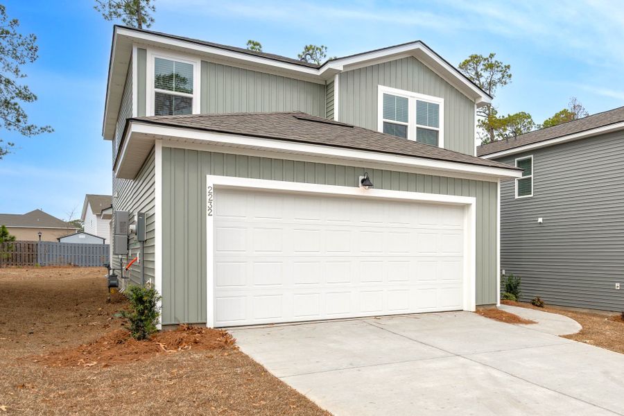 Front exterior of a new home in Grand Arbor, Blythewood, SC, highlighting curb appeal (Image 18).