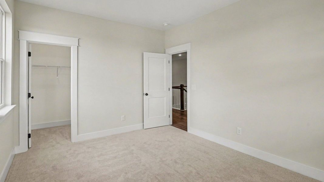 Bedroom with carpet and windows Bedroom with carpet and windows