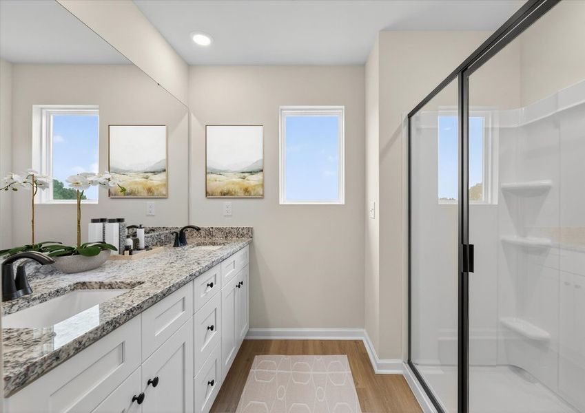The master bathroom has dual sinks