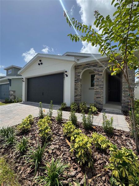 Front exterior of a new home in Hills of Minneola, Minneola, FL, highlighting curb appeal (Image 1). Front exterior of a new home in Hills of Minneola, Minneola, FL, highlighting curb appeal (Image 1).