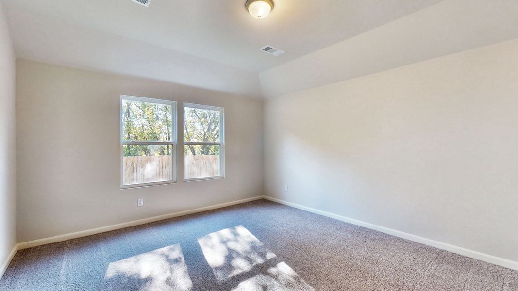 A room with a rug and windows. A room with a rug and windows.