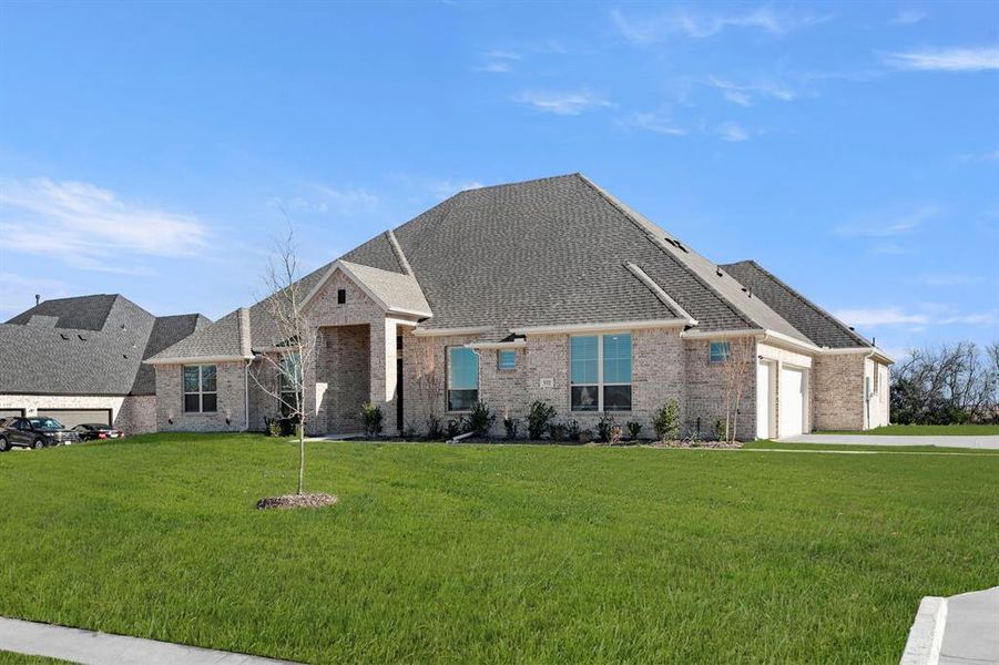 Front exterior of a new home in Heritage, McLendon-Chisholm, TX, highlighting curb appeal (Image 2).