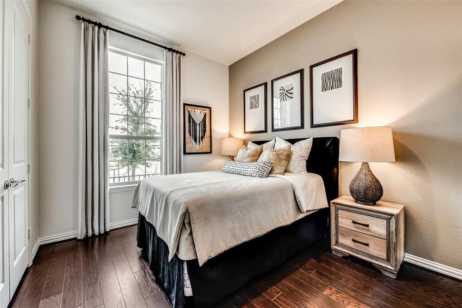 Bedroom with dark wood finished floors