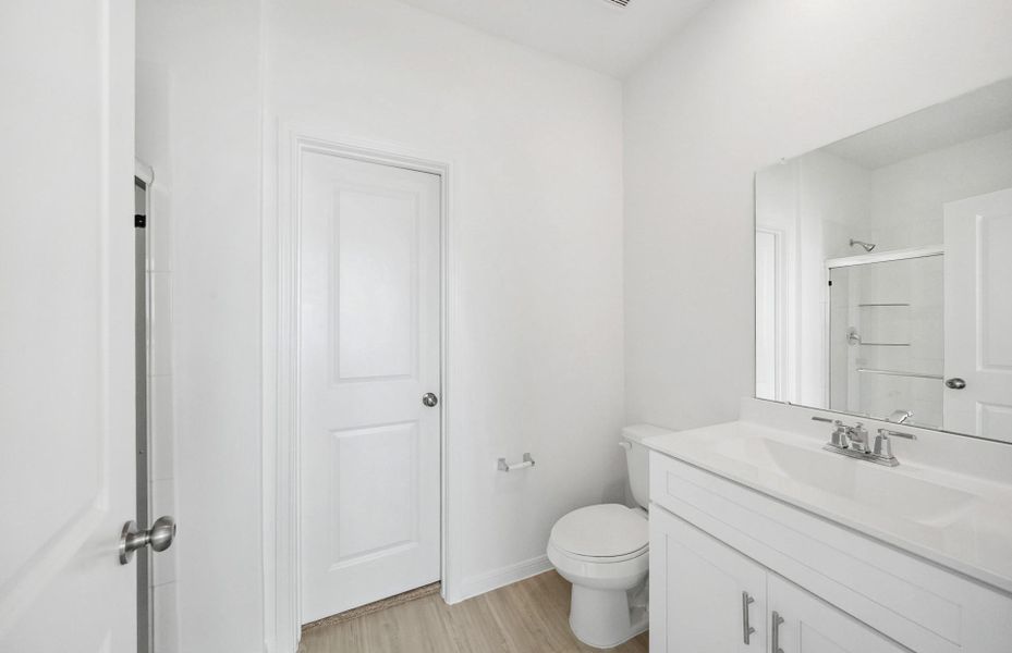 Furnished interior view inside a new home in The Pines At Seven Coves, Conroe (Image 5).