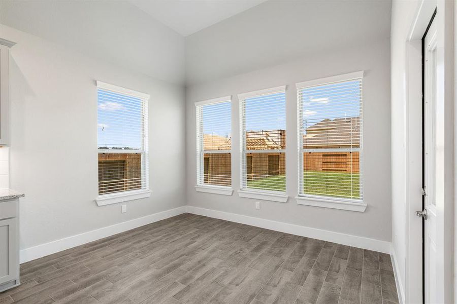 Step through the back door for a breath of fresh air onto the covered patio, extending your living space to the outdoors. Sample photo of completed home with similar floor plan. As-built interior colors and selections may vary.