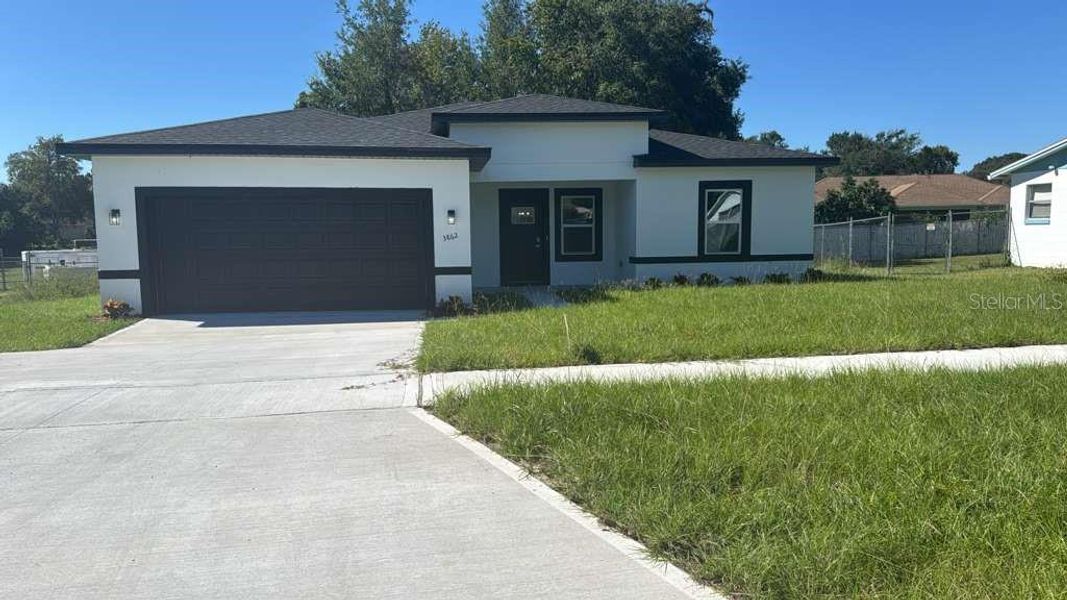 Front exterior of a new home in , Ocala, FL, highlighting curb appeal (Image 1). Front exterior of a new home in , Ocala, FL, highlighting curb appeal (Image 1).