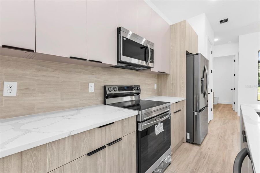 Furnished interior view inside a new home in , Port Charlotte (Image 18).