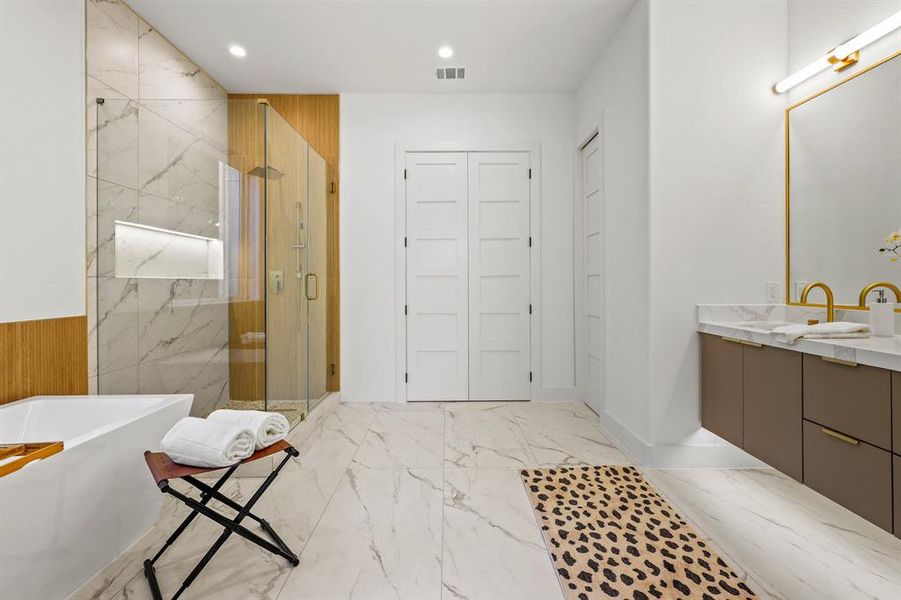 Bathroom with plus walk in shower, tile patterned floors, and vanity