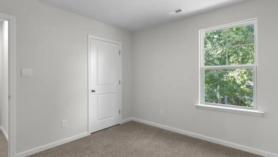 Spacious, unfurnished interior of a new home in The Highlands at Cedar Hill Landing, Navassa (Image 33).