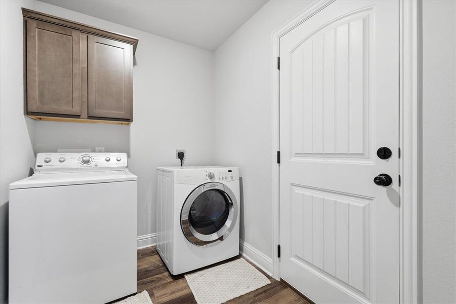 Functional laundry room offering convenient space for everyday household tasks and storage.