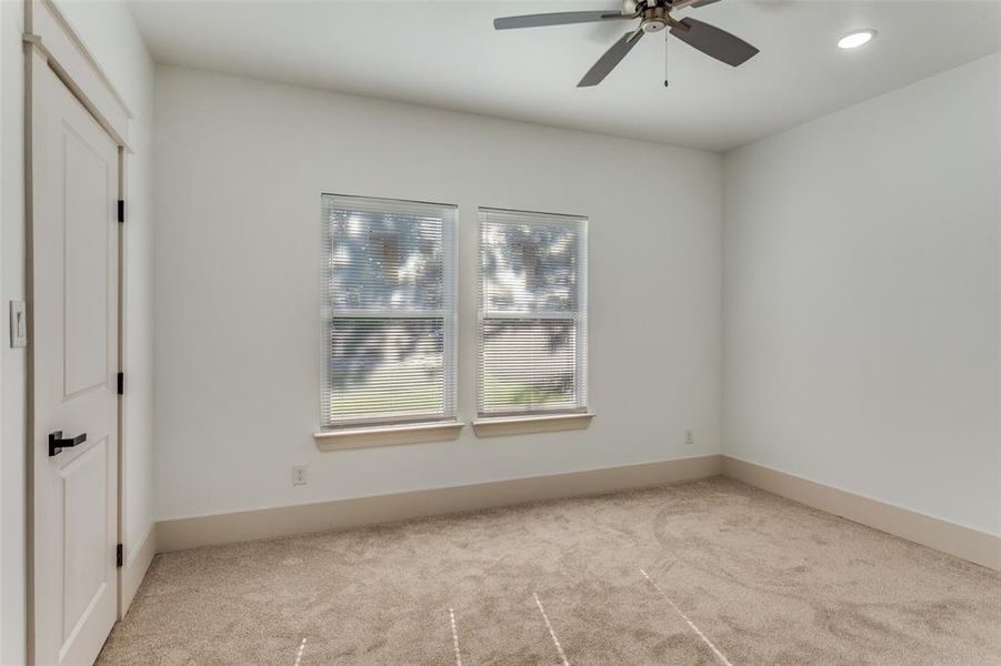 Spare room featuring light carpet, a ceiling fan, and recessed lighting Spare room featuring light carpet, a ceiling fan, and recessed lighting