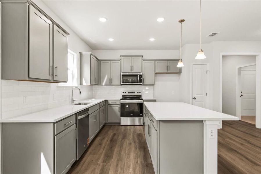 Kitchen with grey cabinetry Kitchen with grey cabinetry