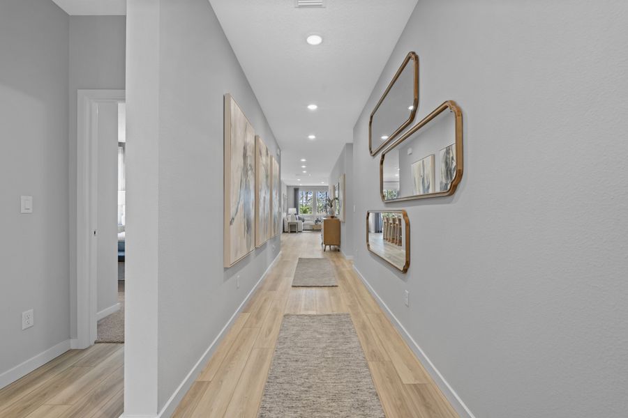Coronado Model Home Entryway with a mirror and a rug at Reserve East in Flagler Beach Coronado Model Home Entryway with a mirror and a rug at Reserve East in Flagler Beach