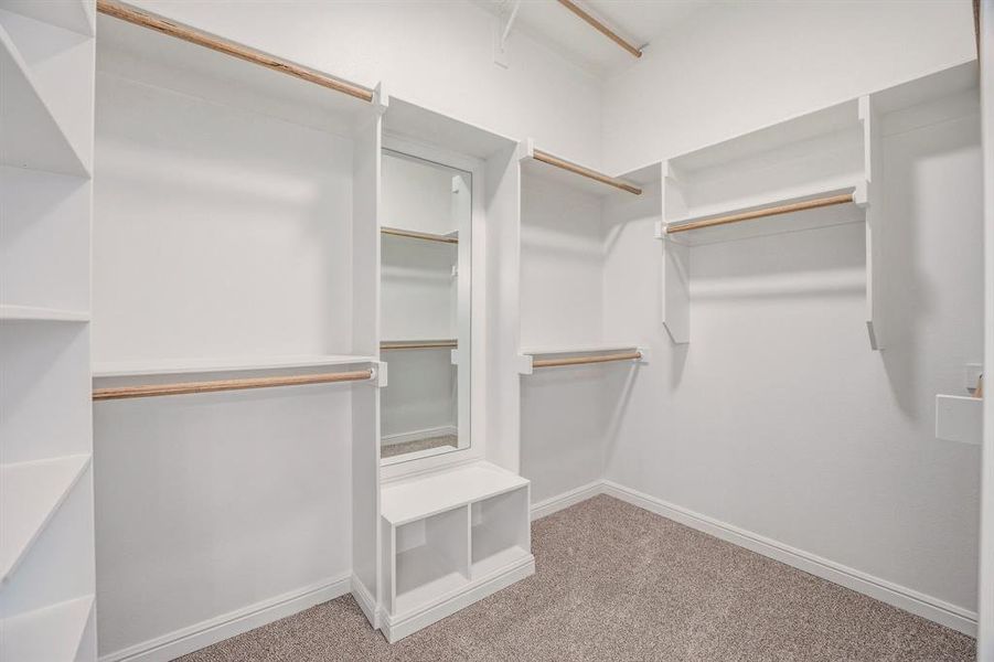 Walk in closet with light carpet Walk in closet with light carpet
