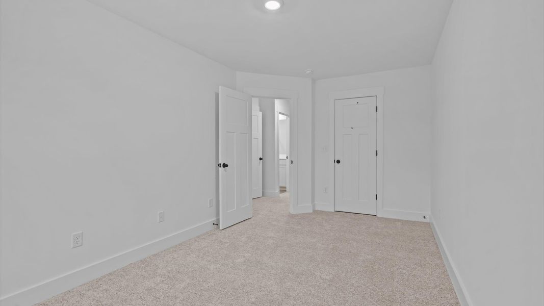 First-class secondary bedroom with comfortable carpeted flooring and generous closet space First-class secondary bedroom with comfortable carpeted flooring and generous closet space
