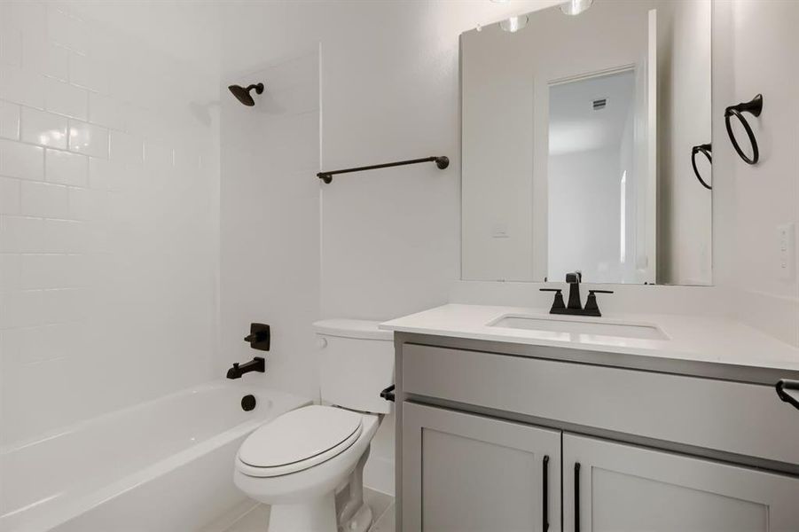 Full bathroom featuring vanity and shower / tub combination