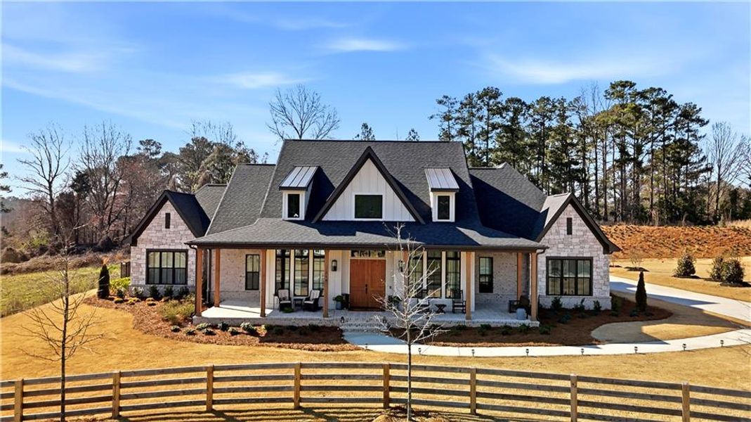 Front exterior of a new home in , Woodstock, GA, highlighting curb appeal (Image 27). Front exterior of a new home in , Woodstock, GA, highlighting curb appeal (Image 27).