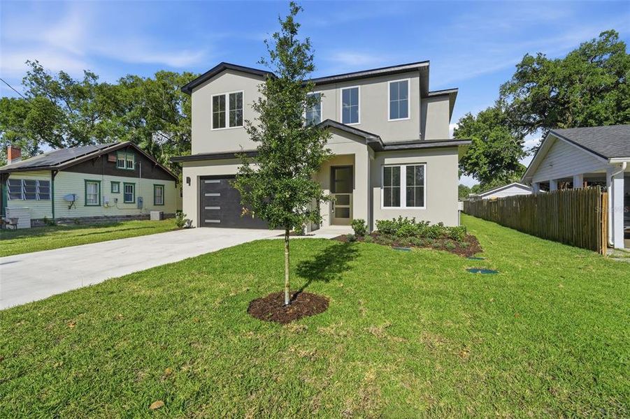 Front exterior of a new home in , Orlando, FL, highlighting curb appeal (Image 29).