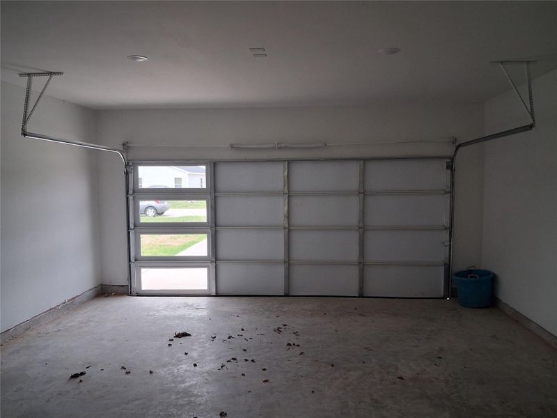 The garage door allows the daylight to come through the glass.