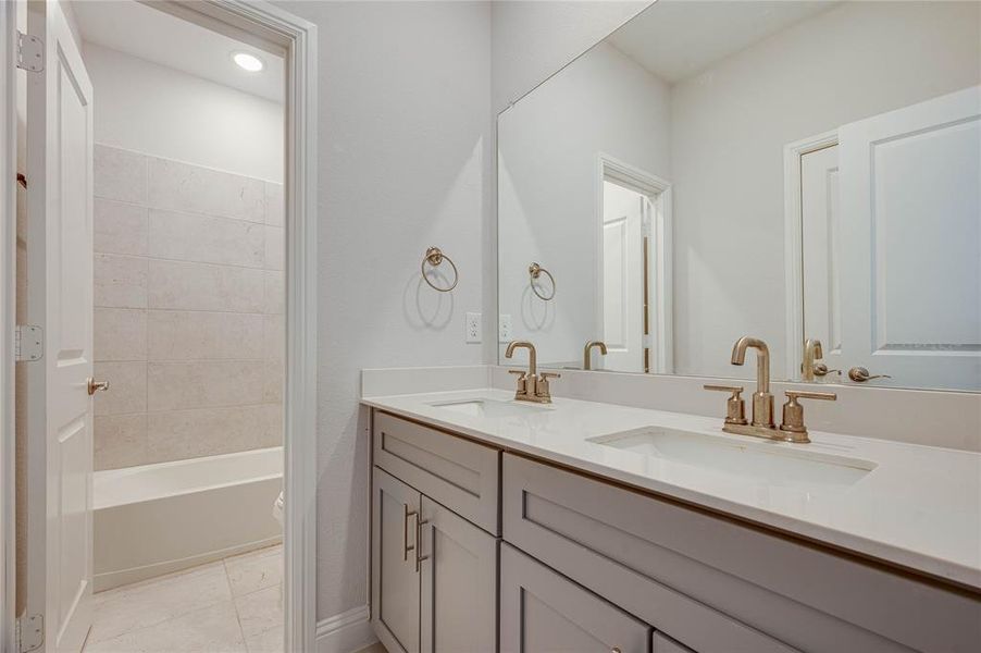 4th full bath located near 4th and 5th bedrooms features a linen closet & separate private shower area.