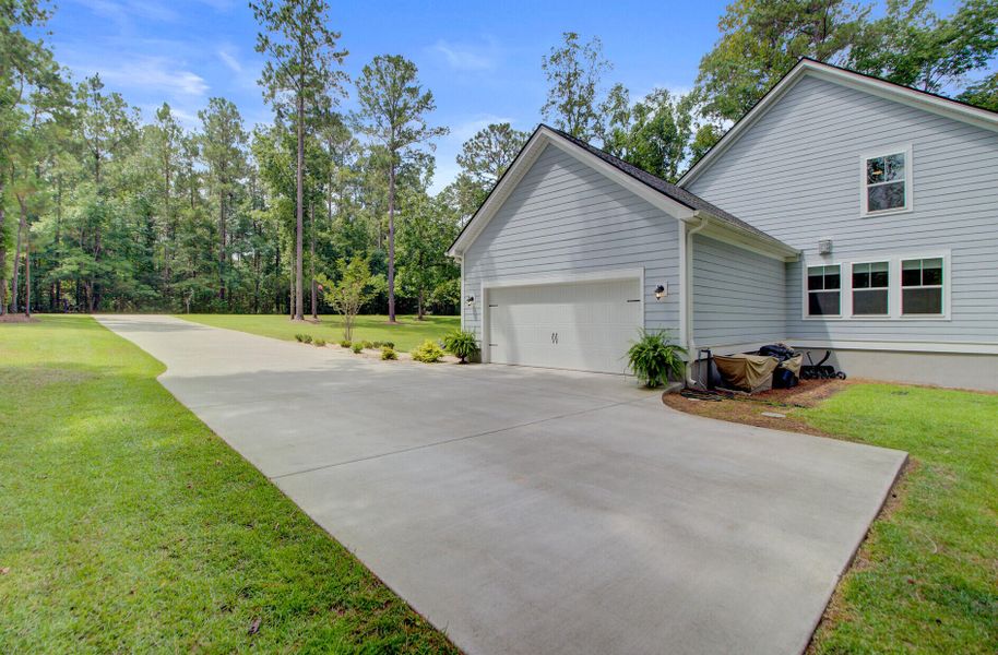 Front exterior of a new home in , Ridgeville, SC, highlighting curb appeal (Image 21). Front exterior of a new home in , Ridgeville, SC, highlighting curb appeal (Image 21).