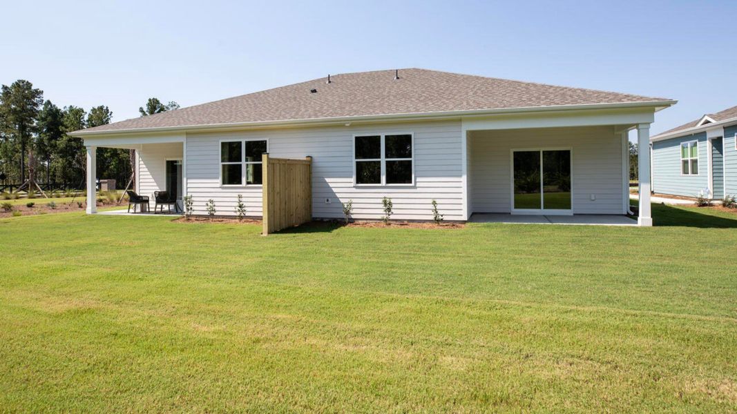 Exterior details and patio area of a home in Indigo Preserve Townhomes, Leland (Image 17).