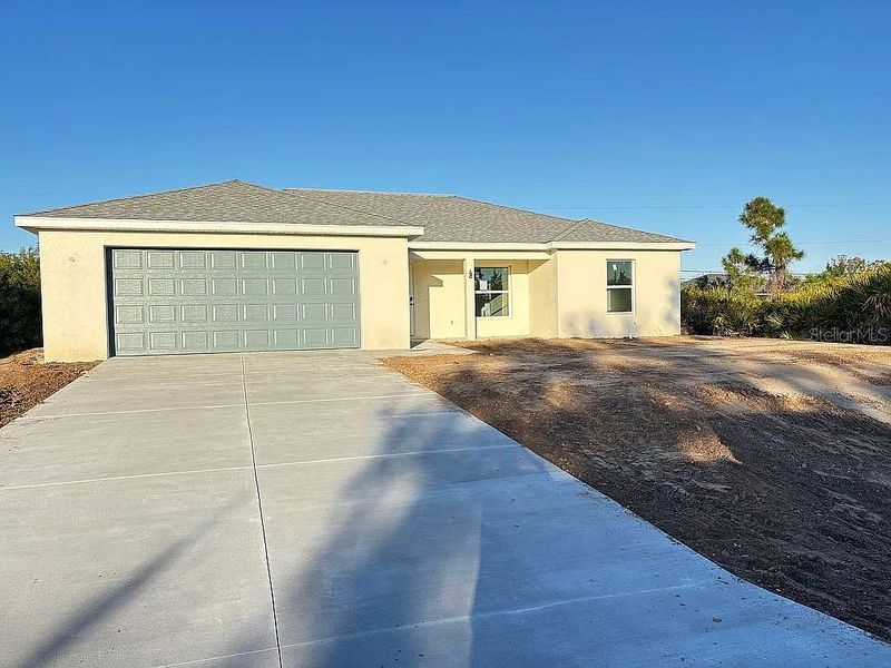 Front exterior of a new home in , Englewood, FL, highlighting curb appeal (Image 2). Front exterior of a new home in , Englewood, FL, highlighting curb appeal (Image 2).