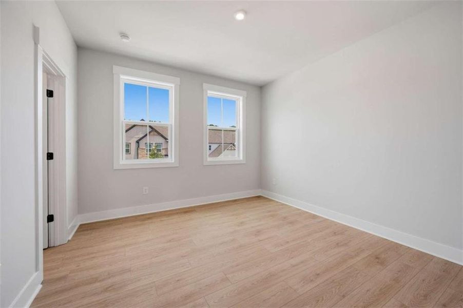 Spacious, unfurnished interior of a new home in The Paddocks at Doc Hughes, Buford (Image 25).
