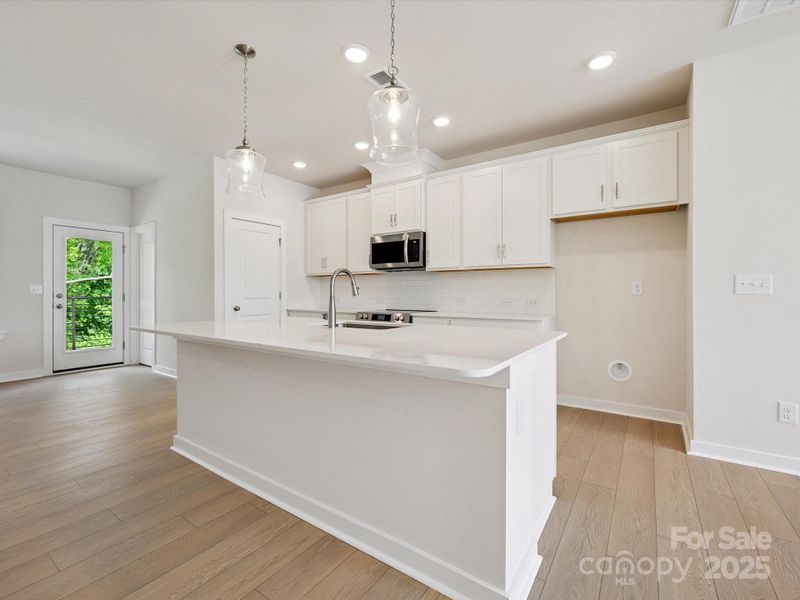 Furnished interior view inside a new home in Central Living at Craig, Charlotte (Image 15).