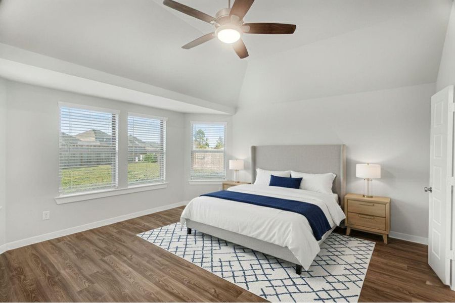 Secluded primary bedroom overlooking the backyard, where bay windows frame beautiful sunset views. (Virtually Staged) Secluded primary bedroom overlooking the backyard, where bay windows frame beautiful sunset views. (Virtually Staged)