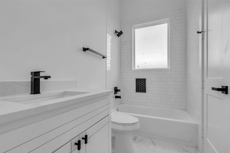 Relax and unwind in this spacioussecondary bathroom, featuring aconvenient tub and shower combo. Relax and unwind in this spacioussecondary bathroom, featuring aconvenient tub and shower combo.