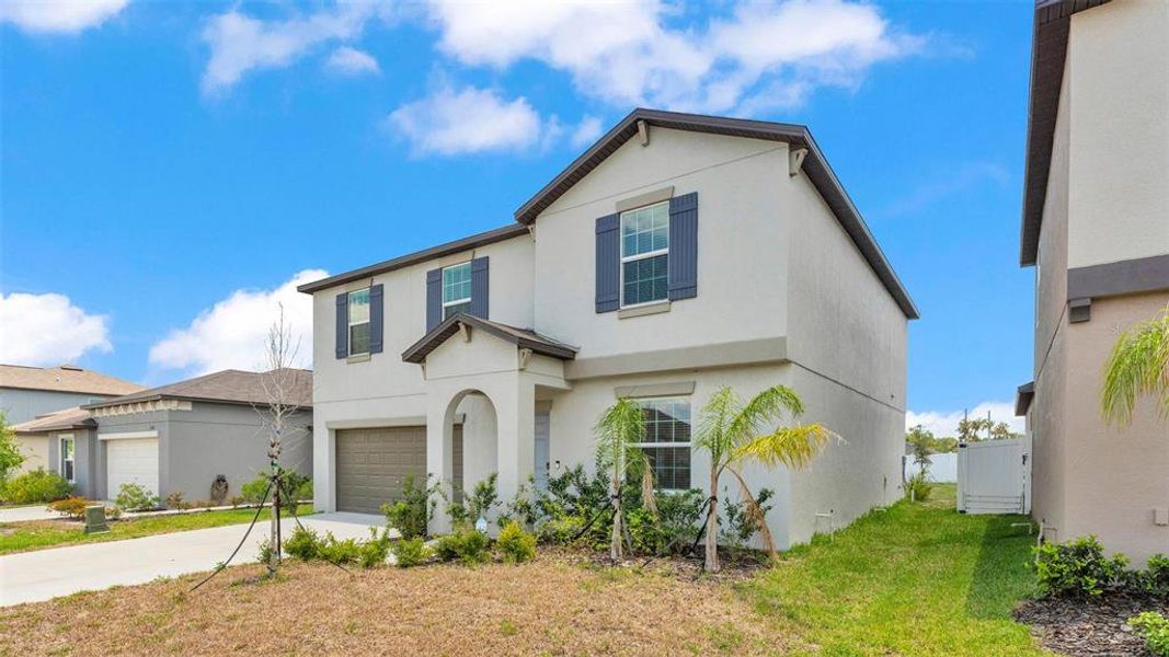 Front exterior of a new home in , Bartow, FL, highlighting curb appeal (Image 1).