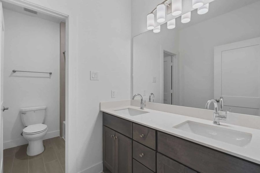 Representative furnished interior of a home built from the Waterford by Chesmar Homes in Meridiana 60's, Manvel (Image 13).