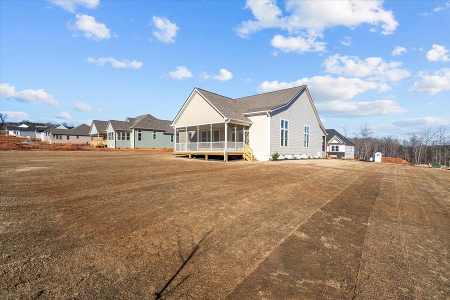 Representative exterior photo of a completed home built from the Caterina Elite by Enchanted Homes in Tubbs Mountain Estates, Travelers Rest, SC (Image 26).