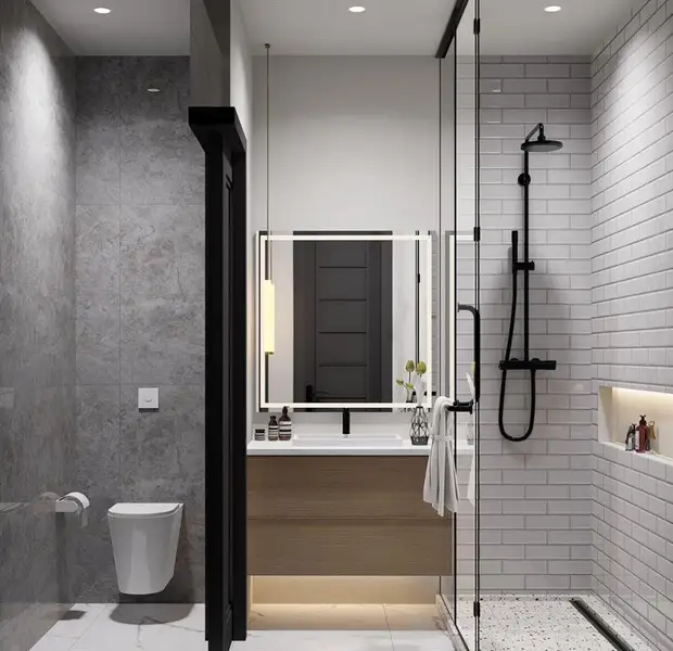 Full bath featuring vanity, a stall shower, tile walls, and recessed lighting