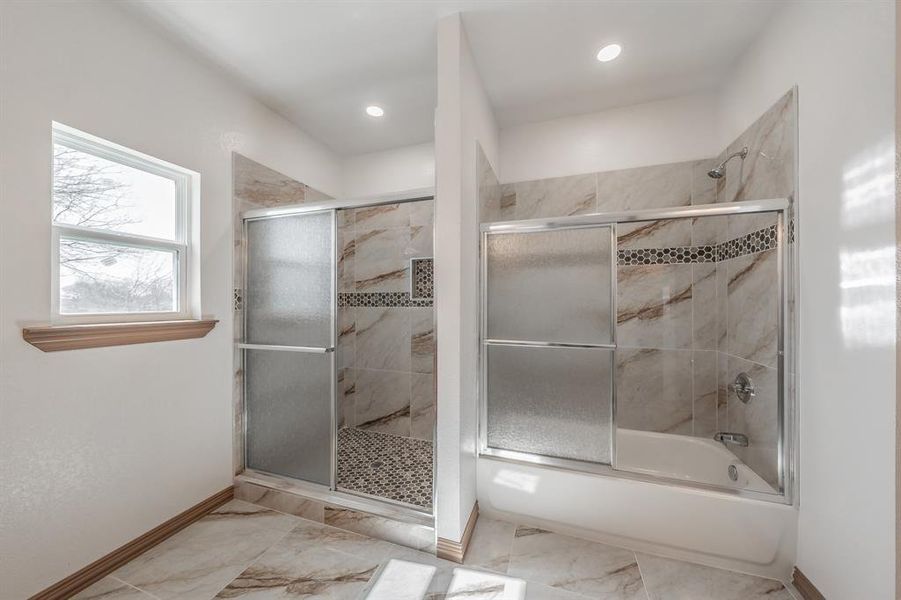 Full bathroom with shower / bath combination with glass door, baseboards, marble finish floor, and recessed lighting