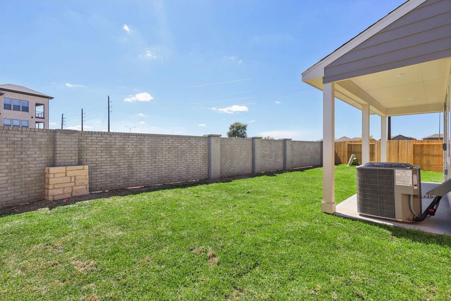 Exterior details and patio area of a home in Parkway Commons - City Series, Missouri City (Image 26).