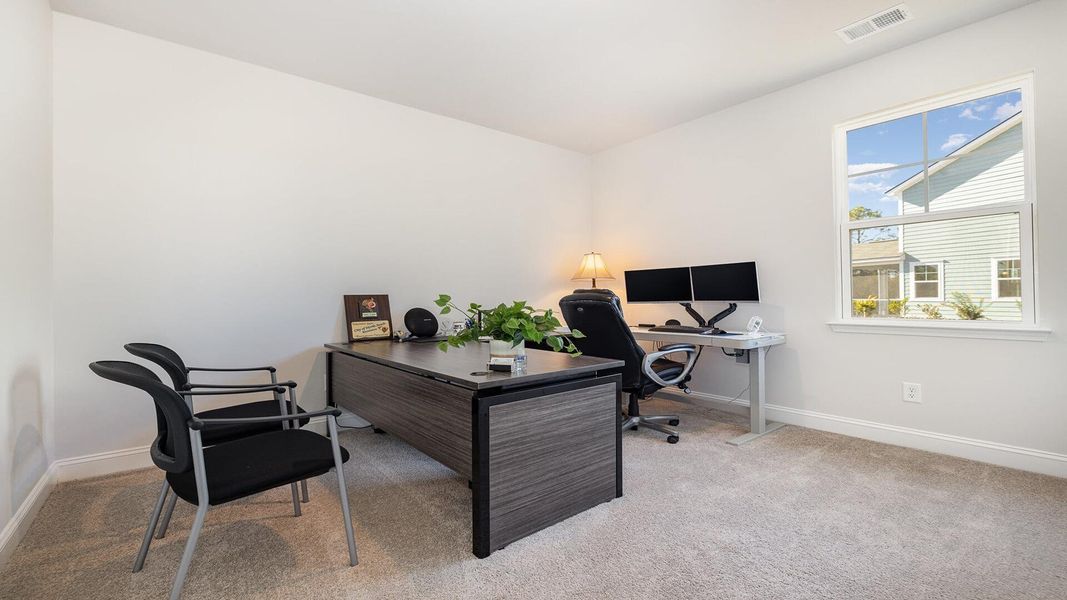 Furnished interior view inside a new home in Pine Hills at Cane Bay, Summerville (Image 11).