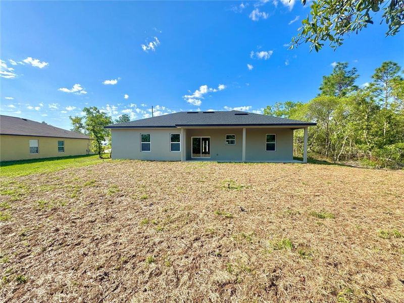Front exterior of a new home in , Citrus Springs, FL, highlighting curb appeal (Image 1).