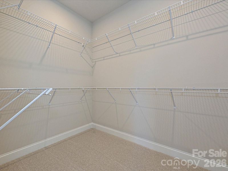 Primary Walk-In Closet Primary Walk-In Closet